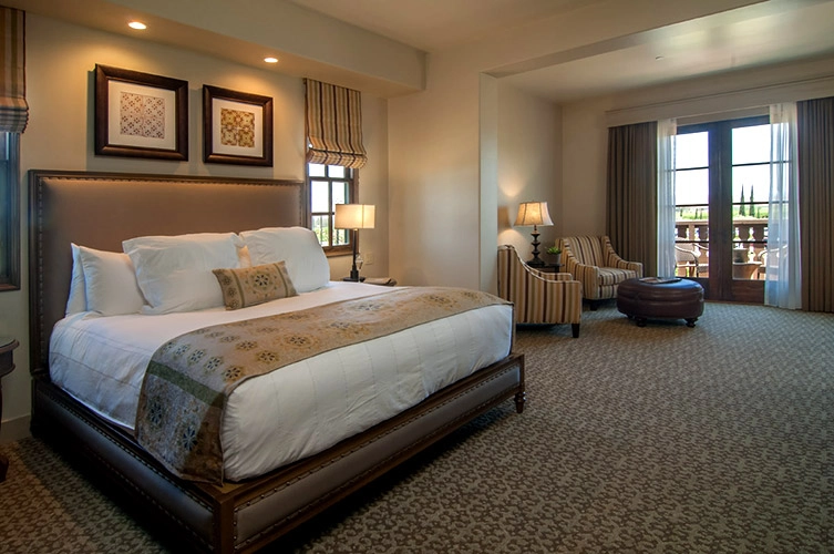 king junior suite with chairs and balcony